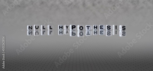 null hypothesis word or concept represented by black and white letter cubes on a grey horizon background stretching to infinity