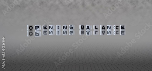 opening balance word or concept represented by black and white letter cubes on a grey horizon background stretching to infinity
