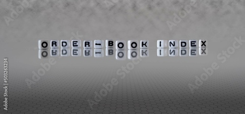 order book index word or concept represented by black and white letter cubes on a grey horizon background stretching to infinity