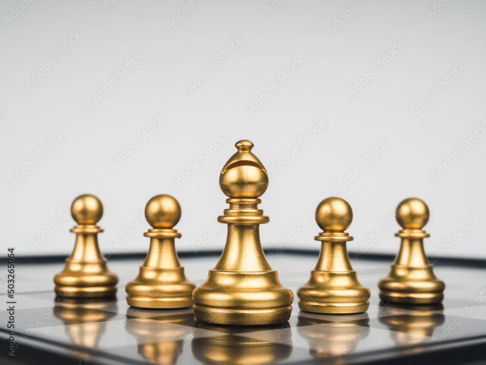 The golden bishop chess piece in front of gold pawns on chess board, white background. Bishop represents the church, important and powerful entity throughout history, religious representative concept. The golden bishop chess piece in front of gold pawns on chess board, white background. Bishop represents the church, important and powerful entity throughout history, religious representative concept.