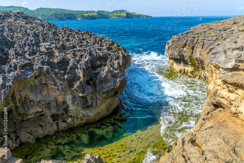 Beautiful crystal water view of angel bilabong in nusa penida island with rock beside it, bali, indonesia