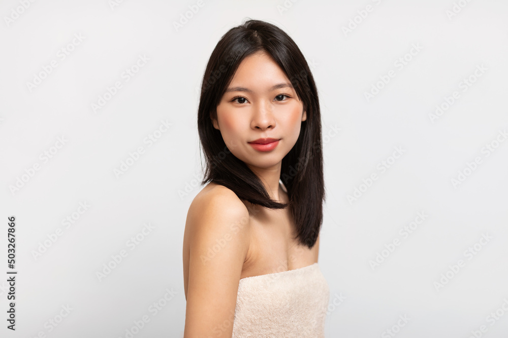 Portrait of young Asian woman posing looking at camera Portrait of young Asian woman posing looking at camera
