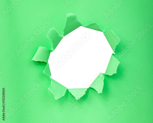 Green color paper with circle hole in damaged background