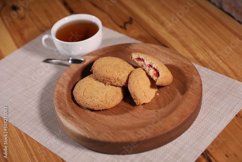 berry tea and a decorative wooden plate is very beautiful for vegetables and cookies, sweets and desserts as an element of decor for interior design