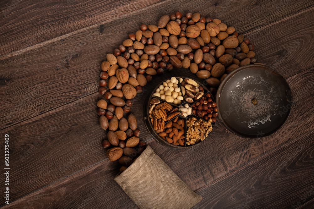 Festive mixed nuts on a dark wood background with copy space Festive mixed nuts on a dark wood background with copy space