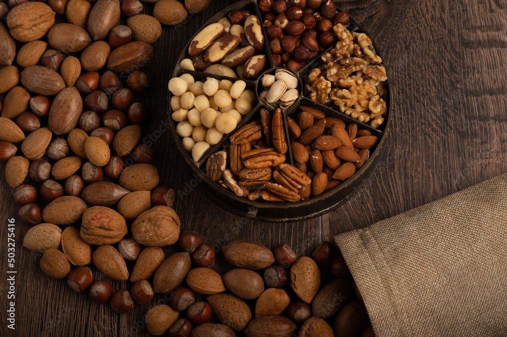 Festive mixed nuts on a dark wood background Festive mixed nuts on a dark wood background