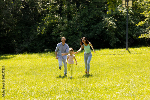 Happy young family with cut...
