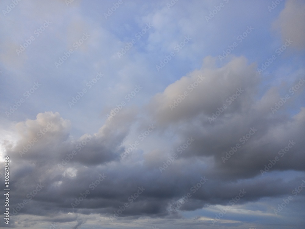Stratocumulus cloud with gray colour and blue sky