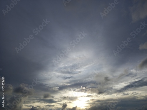 combine cirrostratus and stratocumulus cloud and sunset light behind the cloud
