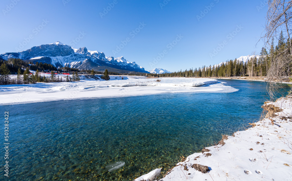 Canadian Rockies Bow Valley beautiful scenery during winter. Snowcapped mountains, Bow River. Mount Rundle. Canmore, Alberta, Canada.