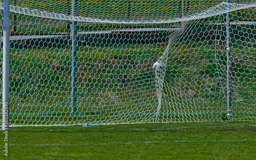 The ball in the goal during a league match.