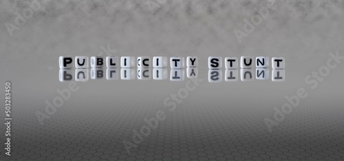 Fotografie publicity stunt word or concept represented by black and white letter cubes on a