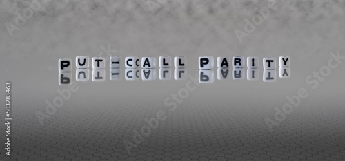 put call parity word or concept represented by black and white letter cubes on a grey horizon background stretching to infinity