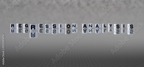 Tableau sur toile regression analysis word or concept represented by black and white letter cubes