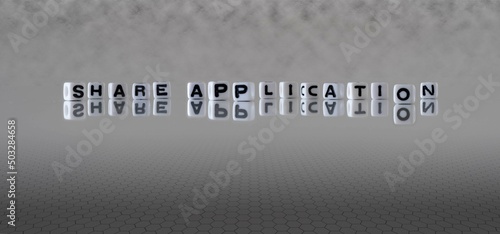 share application word or concept represented by black and white letter cubes on a grey horizon background stretching to infinity
