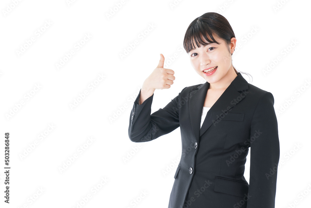 Businesswoman wearing a suit giving OK sign Businesswoman wearing a suit giving OK sign