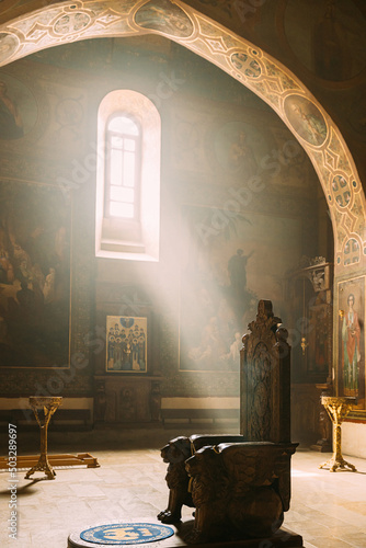 Mtskheta, Georgia. Sun ray shining in church. Fresco, Frescoes. Icons, of Shio-Mgvime Monastery. interior of Upper Church Of Holy Virgin Or Theotokos, Central Part Of Medieval Monastic ShioMgvime