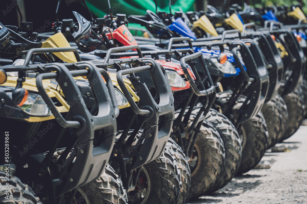 View of row dirty ATVs quad bike View of row dirty ATVs quad bike