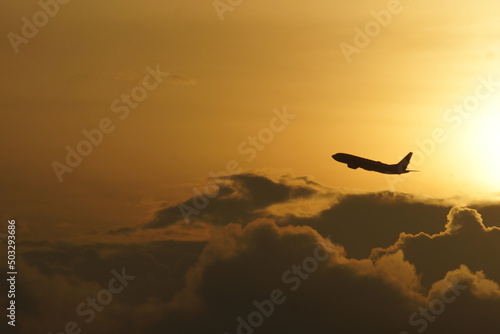 Aircraft taking off on the dawn sky © mymdamin