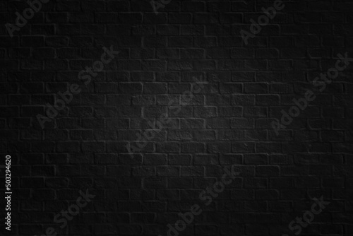 Old black brick texture details background. House, shop, cafe and office design backdrop. Paint brickwork wall and copy space.