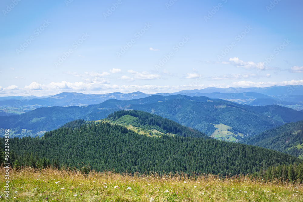 View of the mountains with beautiful clouds on the way to the written stone.Carpathians