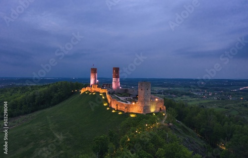 Obraz na płótnie Aerial drone night view over the colorful, illuminated Chęciny Castle (Kielce County, Świętokrzyskie Voivodeship) in Poland w salonie