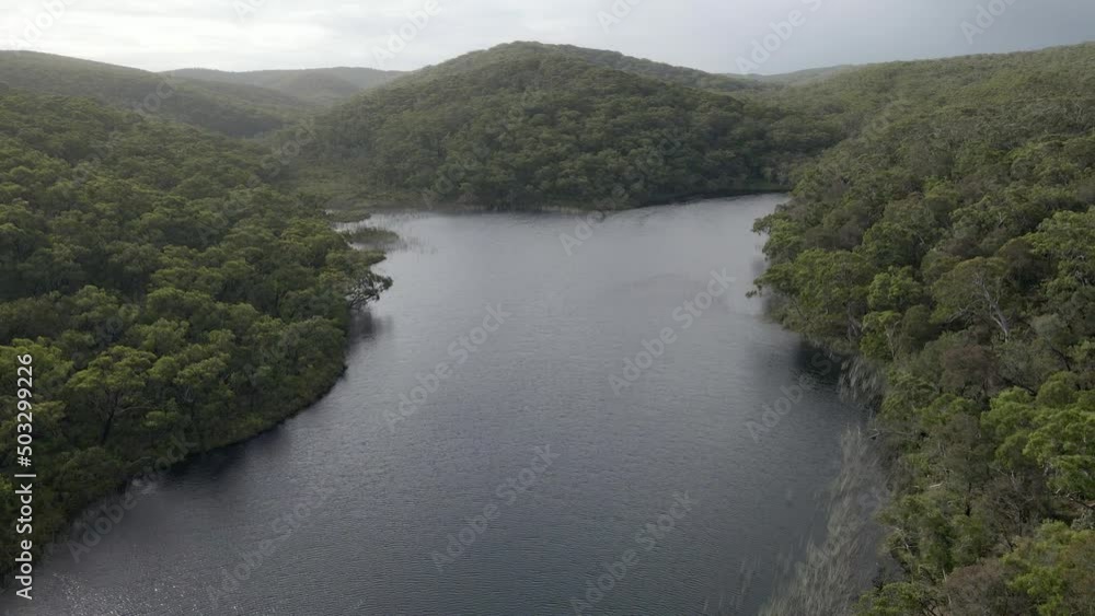 Peaceful Scenery Of Blue Lake National Park On North Stradbroke Island In Queensland, Australia. Aerial Pullback Shot Peaceful Scenery Of Blue Lake National Park On North Stradbroke Island In Queensland, Australia. Aerial Pullback Shot