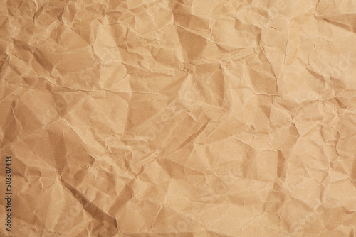 Texture of brown crumpled paper as background, closeup