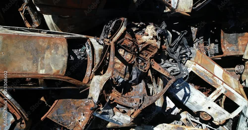 Technology cemetery. Abandoned cars of civilians during the evacuation of the city during the bombing of the city of Bucha. War in Ukraine. Aerial Technology cemetery. Abandoned cars of civilians during the evacuation of the city during the bombing of the city of Bucha. War in Ukraine. Aerial
