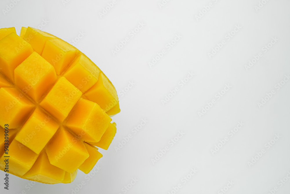 Half cube fresh mango on isolated whited background. Thai tropical fruit for dessert. Half cube fresh mango on isolated whited background. Thai tropical fruit for dessert.