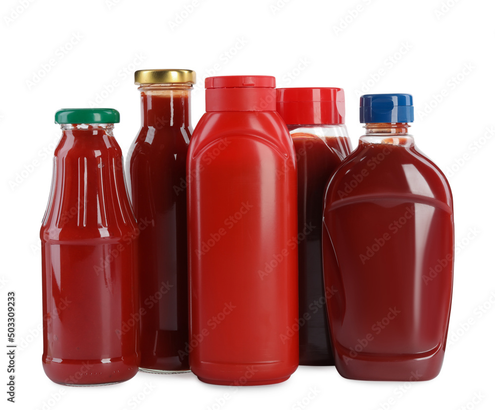 Different bottles of ketchup on white background Different bottles of ketchup on white background