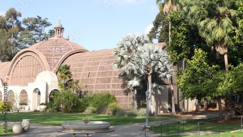 Wallpaper Mural Botanical building exterior or facade in garden, green grass lawn, palm trees and fountain. Spanish colonial revival architecture in Balboa Park, San Diego, California USA. Wooden cupola or dome. Torontodigital.ca