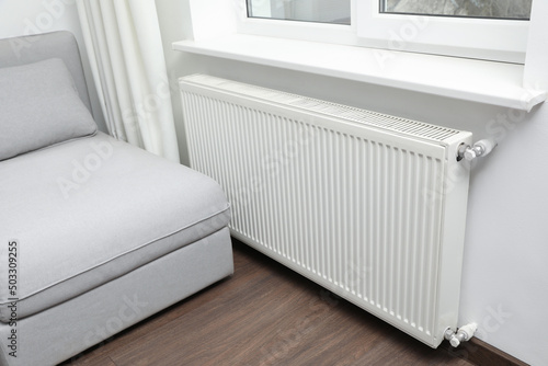 Modern radiator at home. Central heating system