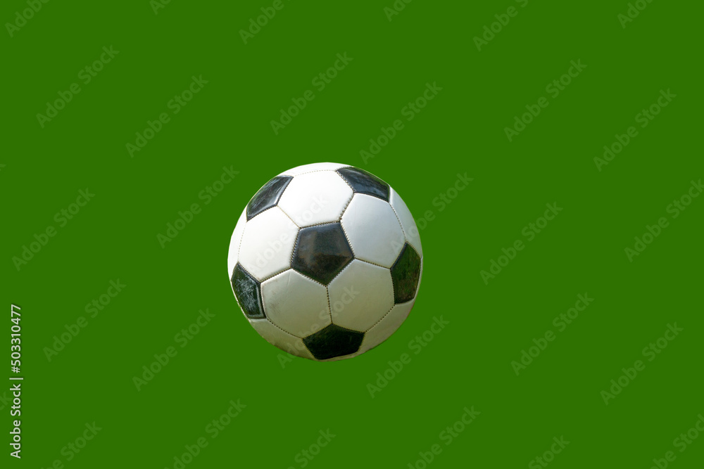 A soccer ball on a solid green background. A soccer ball on a solid green background.