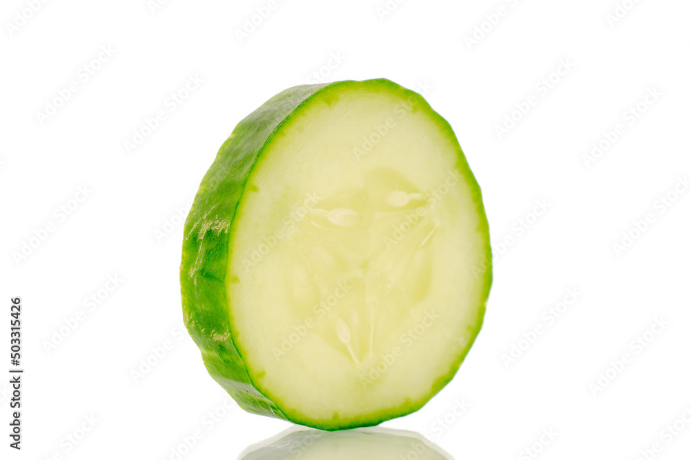One slice of juicy smooth cucumber, macro, isolated on white background. One slice of juicy smooth cucumber, macro, isolated on white background.