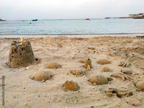 Sea view, cast in the form of fruits and marine fauna on the beach, play time, beach intertainment