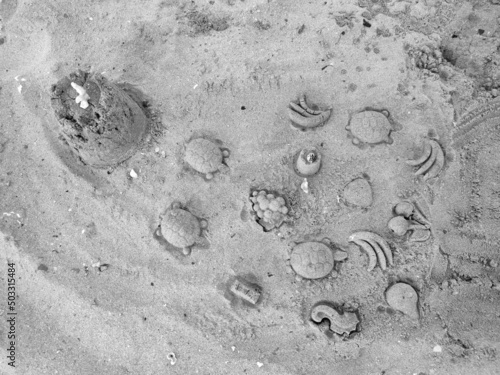 Sea view, cast in the form of fruits and marine fauna on the beach, play time, beach intertainment