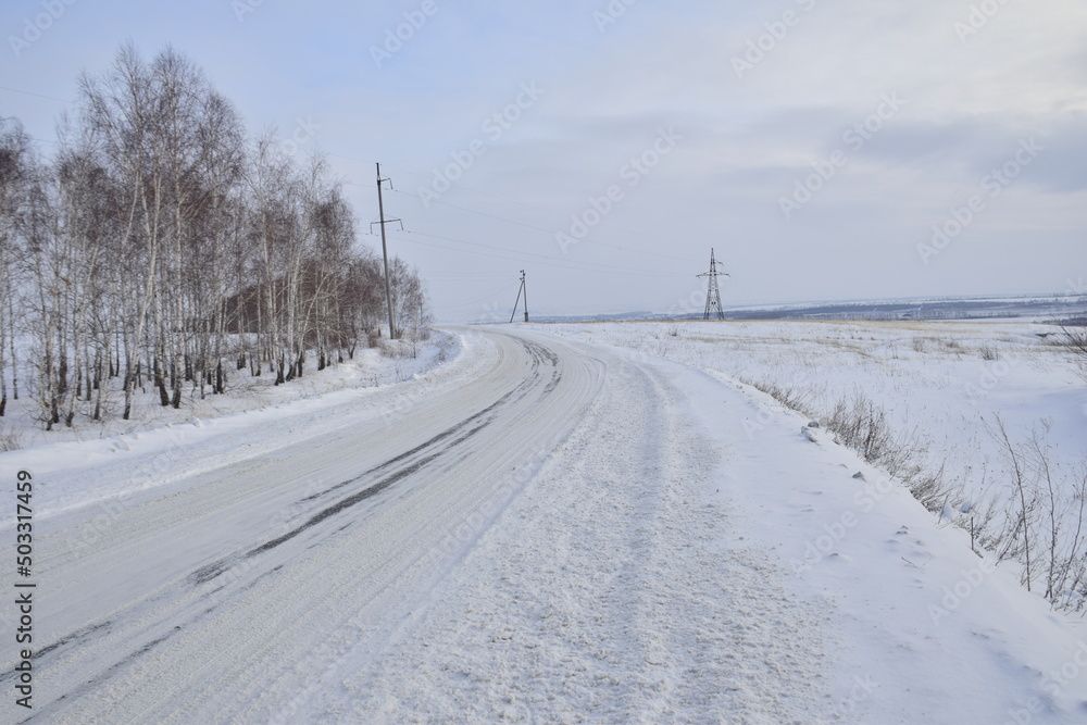 Snow covered dirt road in winter, Russia Snow covered dirt road in winter, Russia