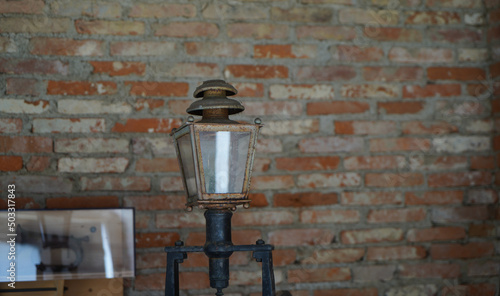 old lamp on brick wall