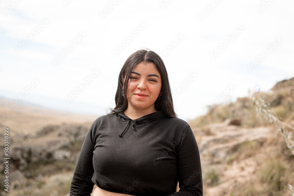 Portrait of latin woman having fun during trekking day in mountain forest - Focus on face Portrait of latin woman having fun during trekking day in mountain forest - Focus on face