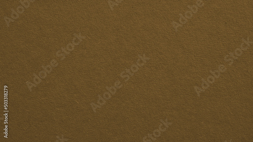 The surface of dark brown cardboard. Paper texture with cellulose fibers. Paperboard wallpaper or background. Textured middle-ground pasteboard backdrop. Elegant and futuristic tint. Macro