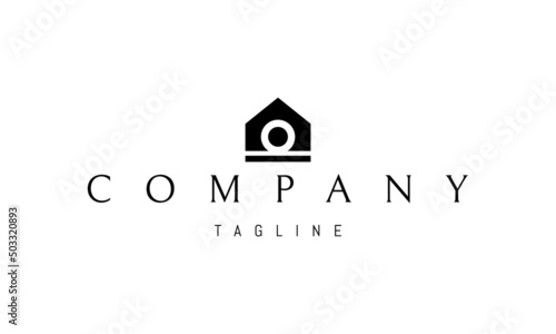 Vector logo on which an abstract image of a house with an omega symbol inside.