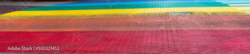 A fragment of the street paved in the colors of the rainbow © Joanna