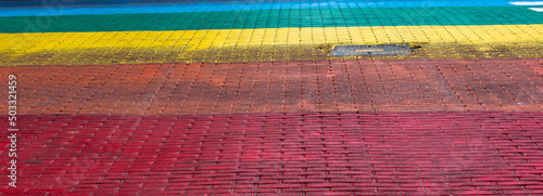 A fragment of the street paved in the colors of the rainbow