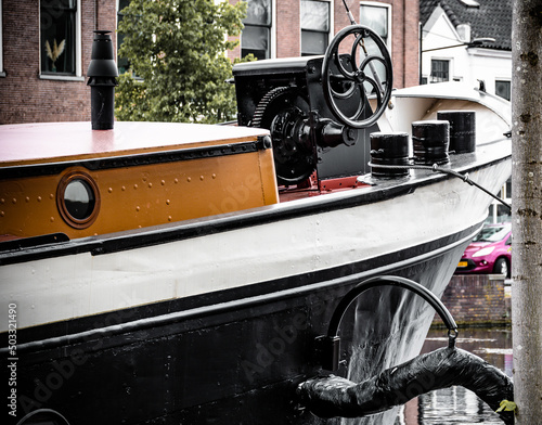 Black-orange barge bow on the canal photo