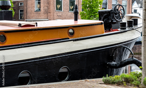 Black-orange barge bow on the canal © Joanna