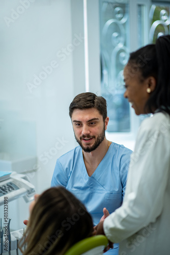 Dentist and patient talking about treatments in a consultation