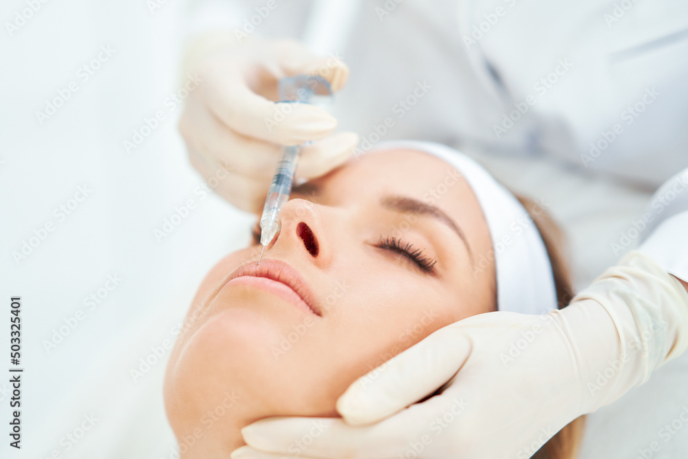 Naklejka premium A scene of medical cosmetology treatments botox injection.