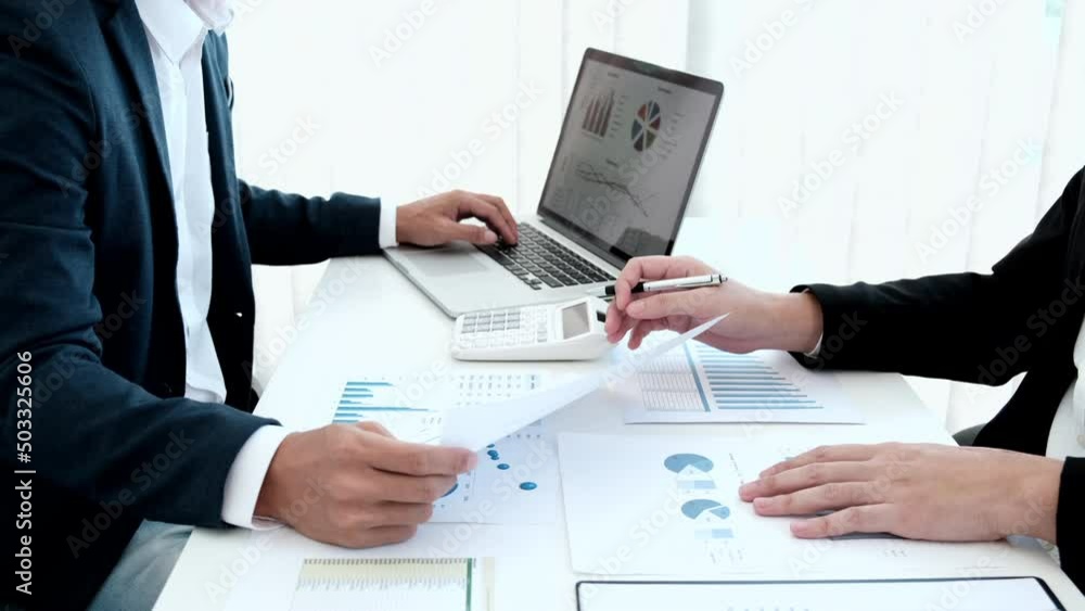 Business team meeting, Financial workers are presenting their annual earnings summary in data graph format to company owners, Brainstorming and Consulting, Cooperate teamwork, work in the office Business team meeting, Financial workers are presenting their annual earnings summary in data graph format to company owners, Brainstorming and Consulting, Cooperate teamwork, work in the office