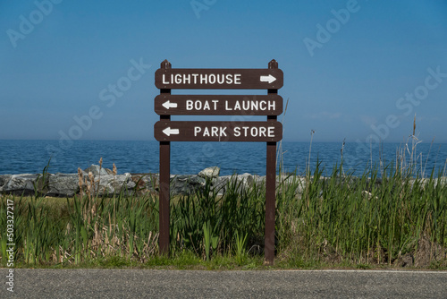 Point Lookout, Maryland USA SIgns in the National Park pointing to the lighthouse, boat launch, and park store.